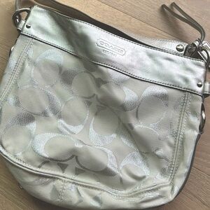 Classic Signature Coach Silver tone shoulder bag.